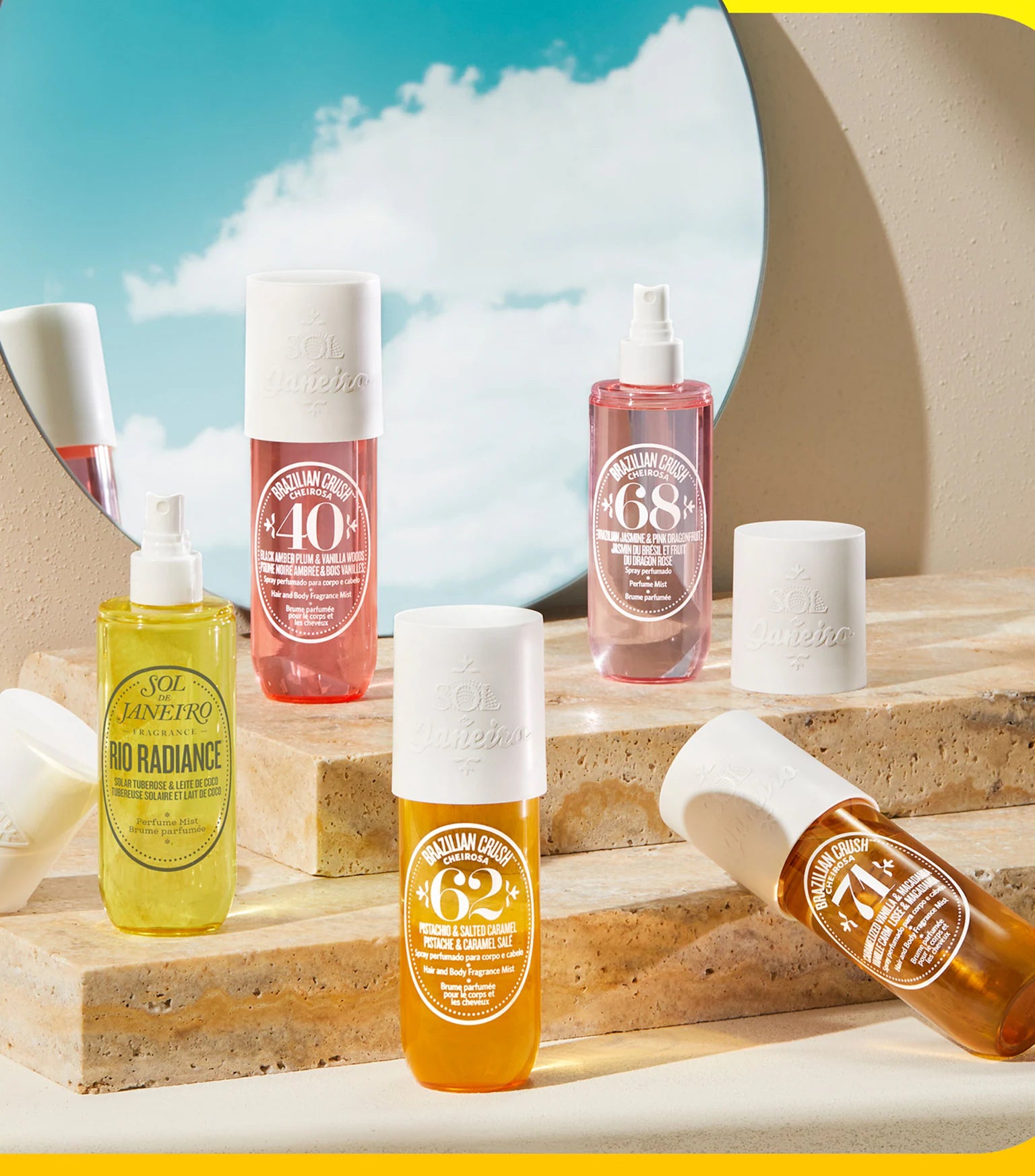 Collection of skincare bottles with visible branding on a wooden surface with a blue sky background.